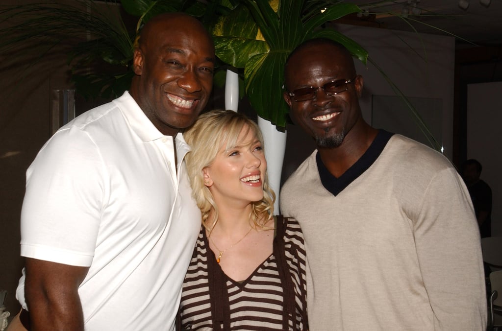 Scarlett smiled with her The Island costars Michael Clarke Duncan and Djimon Hounsou in 2005.