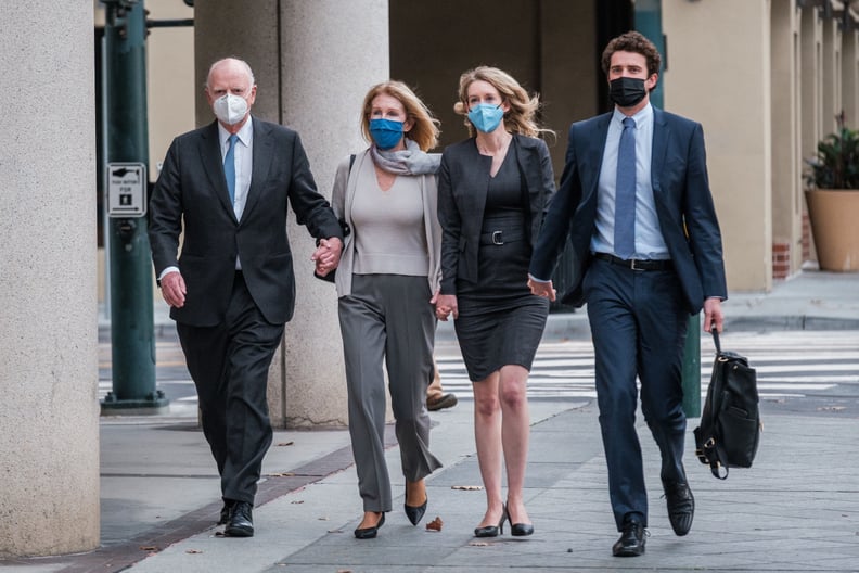 Elizabeth Holmes (2R) walks with her partner Billy Evans (R) and her parents Christian (L) and Noel (2L) Holmes, to the federal court to hear the verdict in her fraud trial in San Jose, California, January 3, 2022. - Fallen US biotech star Elizabeth Holme