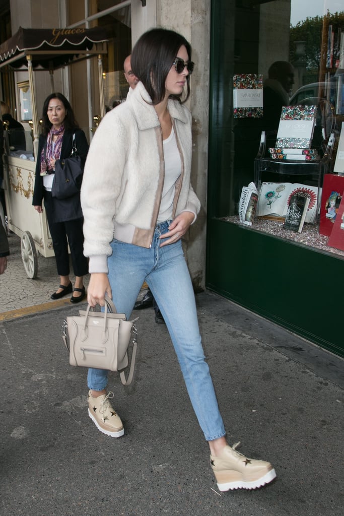 Wearing Komono sunglasses, Stella McCartney creepers, and carrying a Céline bag.