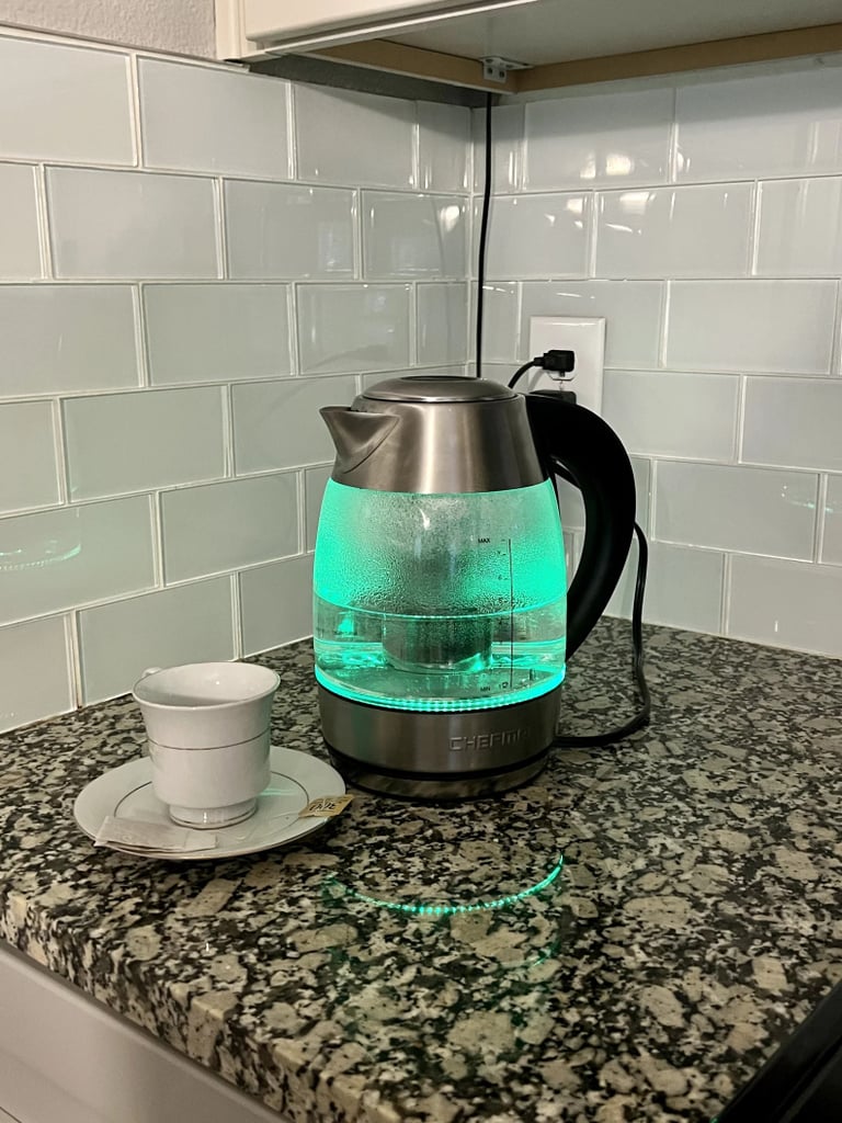 Chefman 1.8L 1500W Glass Electric Kettle ($24, originally $28)
If you're an avid tea drinker, you'll want to treat yourself to this electric kettle. It has a built-in tea infuser, a "keep warm" setting, and automatically shuts off. Our editor tested it out and was delighted by how it cuts tea-making time in half. Read all about her experience in our Chefman 1.8L 1500W Glass Electric Kettle review.
Editor Quote: "More than anything else, I appreciate that this electric kettle takes all the hassle out of having to boil water — whether it be for a cup of tea, hot cocoa, or even soup. I simply plug the product's swivel base into a power outlet, place the kettle (filled with water to the maximum line) on top of the base, and the appliance instantly turns on. The tool features a variety of settings and buttons on the kettle's handle, which allow you to adjust the temperature at which you'd like to heat the water, as well as the duration of time you'd like the water to stay warm after it's finished boiling." — Kyley Warren, former assistant shopping editor