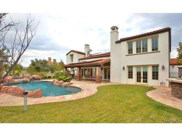 An in-ground pool and spa make the backyard the perfect place to throw a party.