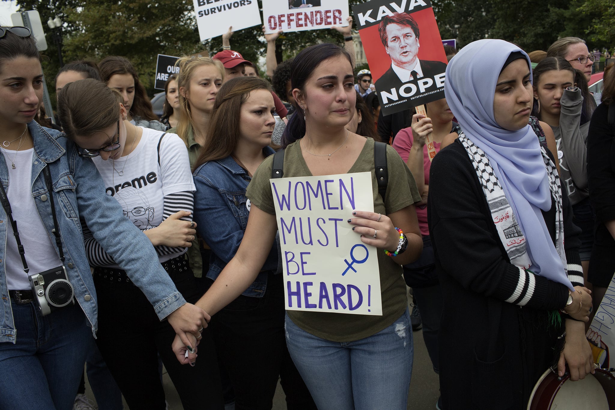 WASHINGTON, D.C. - OCTOBER 6: As the United States Senate prepares to vote to confirm Judge Brett Kavanaugh's nomination to the Supreme Court, women opposed to his nomination gather in front of the Supreme Court to share their stories of sexual assault on October 6, 2018 in Washington, D.C.. (Photo by Andrew Lichtenstein/Corbis via Getty Images)