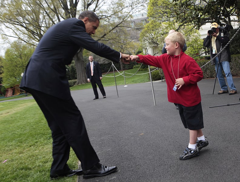 Perfecting his fist bump on the White House lawn in 2009.