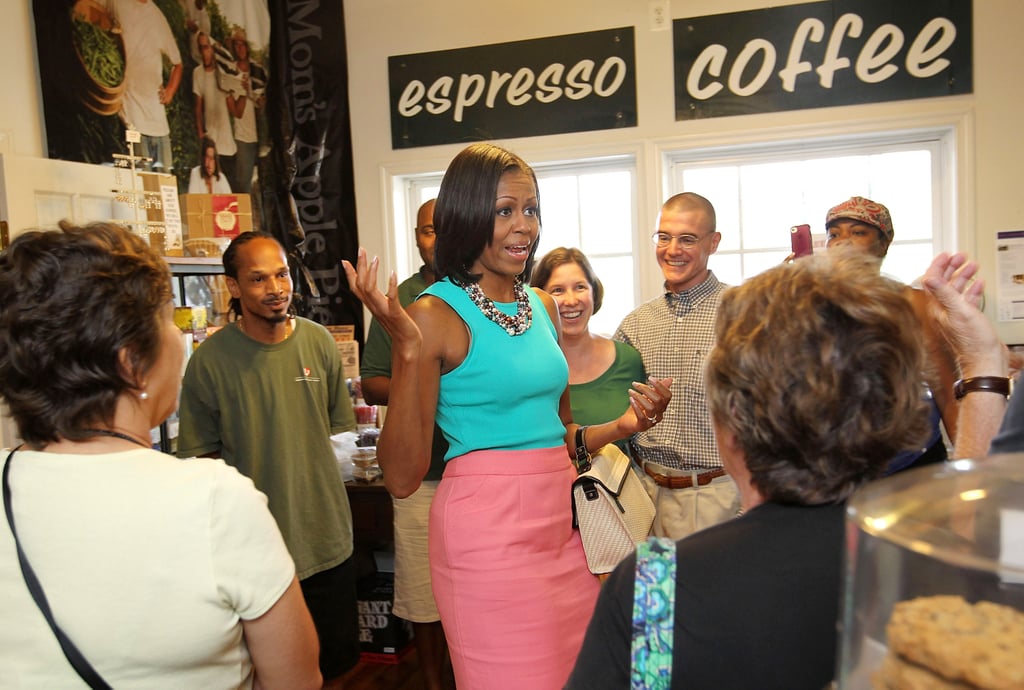 Wearing an Ann Taylor tank and carrying a Jason Wu for Target handbag at a local bakery in Virginia in 2010.