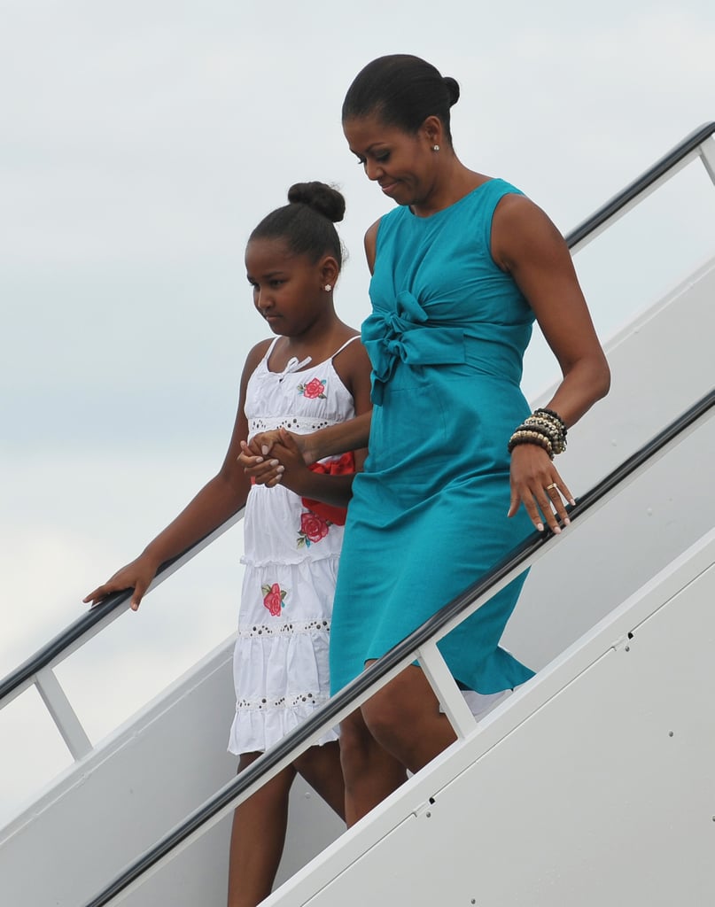 Michelle wearing a gathered turquoise dress on her way to Panama City, Florida.
