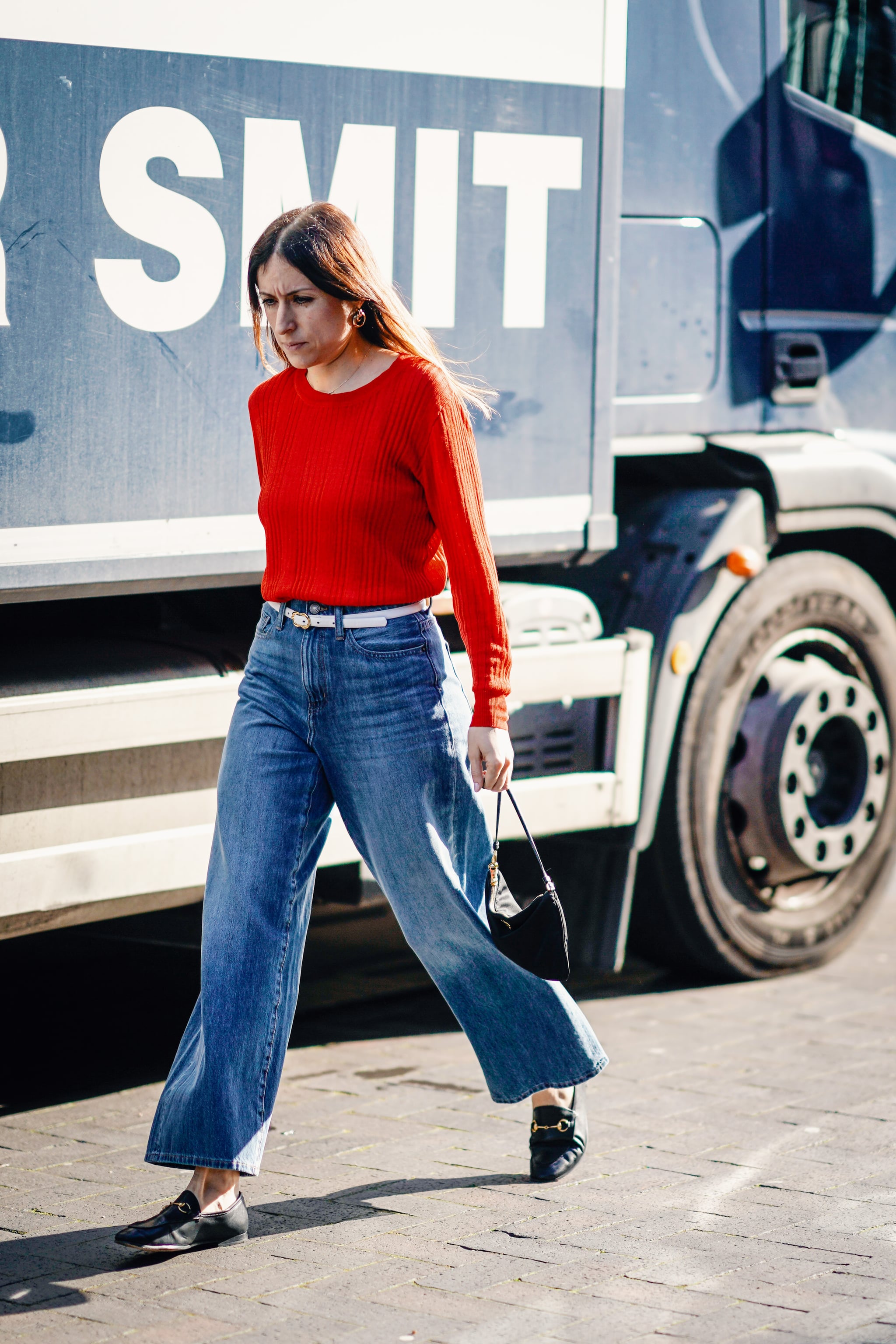 A smart knit, loafers, and cropped denim is a chic combo
