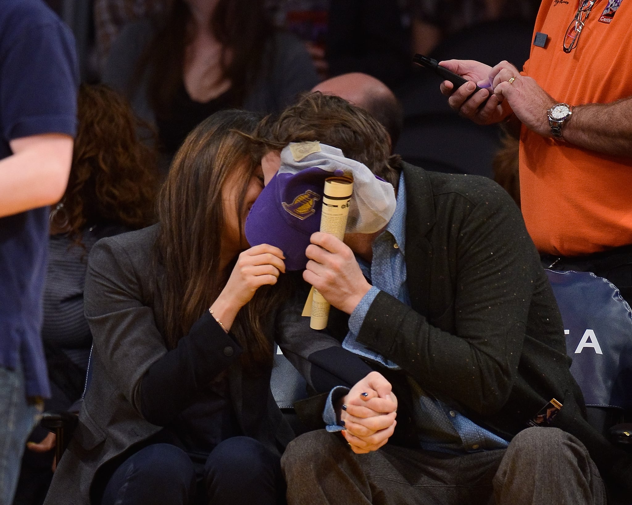 The sweet duo snuck a kiss at a January 2014 Lakers game in LA.