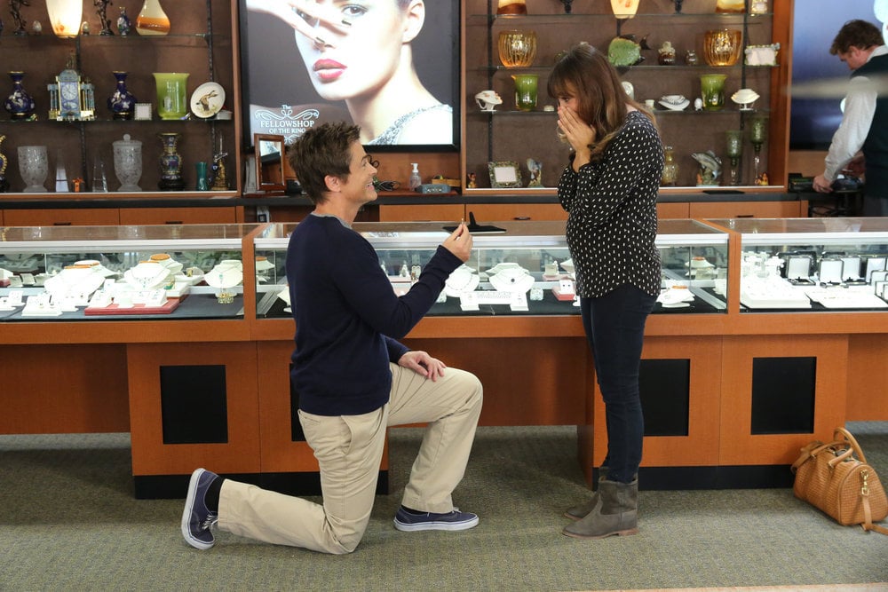 Chris gets down on one knee.