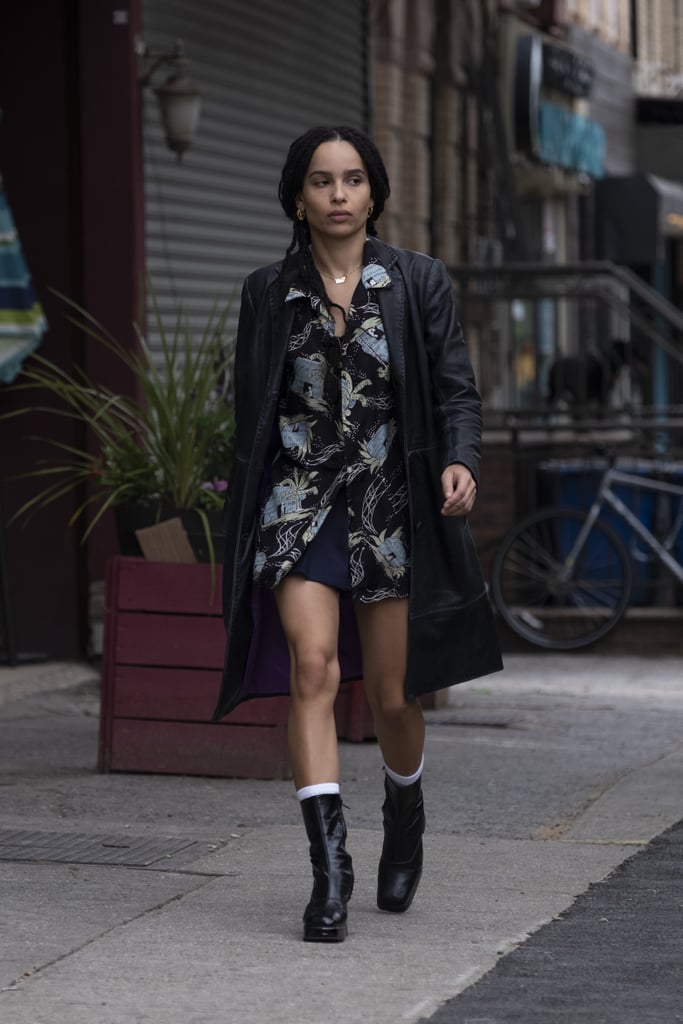 Throughout the season, Zoë found fresh ways to style her long leather trench coat. We particularly love the look where she paired it with a black printed button-down and chunky boots.