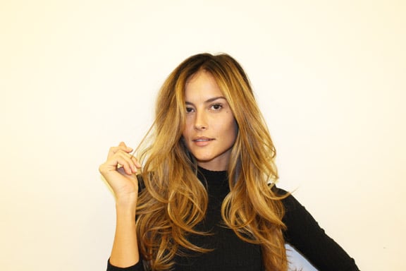 With warm honey tones and nutmeg- and cinnamon-inspired pieces, this rooty golden blond is achieved much faster than your typical ombré hairstyle. "The color was done in a normal single process and I hand-painted brighter bits in foil to give it a multidimensional look," says Ryan.