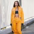 Julia Fox Sat Front Row at Diesel in a Yellow Leather Set and Latex Bandeau Top