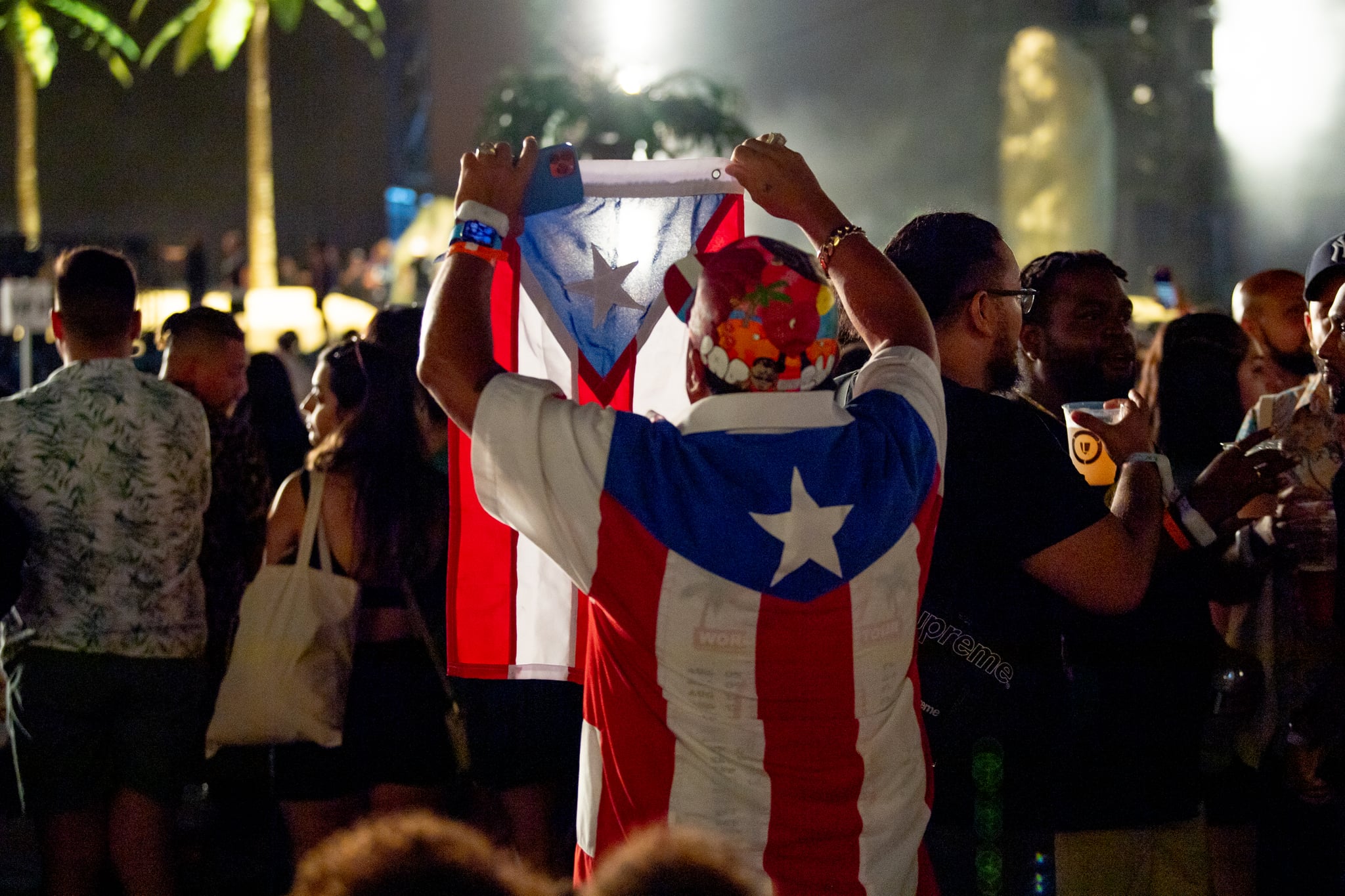 NEW YORK, NEW YORK - AUGUST 27: Members of the audience wear the Puerto Rico flag as Bad Bunny performs at Yankee Stadium on August 27, 2022 in New York City. (Photo by Roy Rochlin/Getty Images)