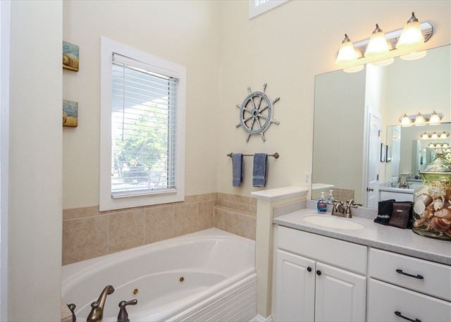 The master bathroom has a whirlpool bathtub and a large shower.