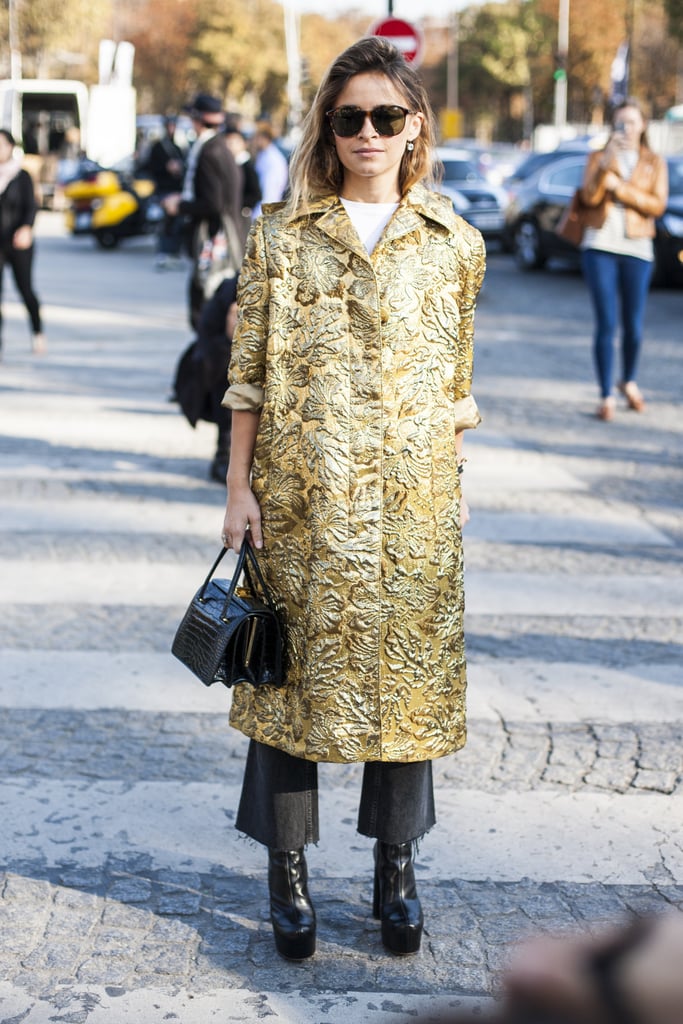 . . . Miroslava Duma did the same, buttoning hers up over trousers and a tee in Paris.