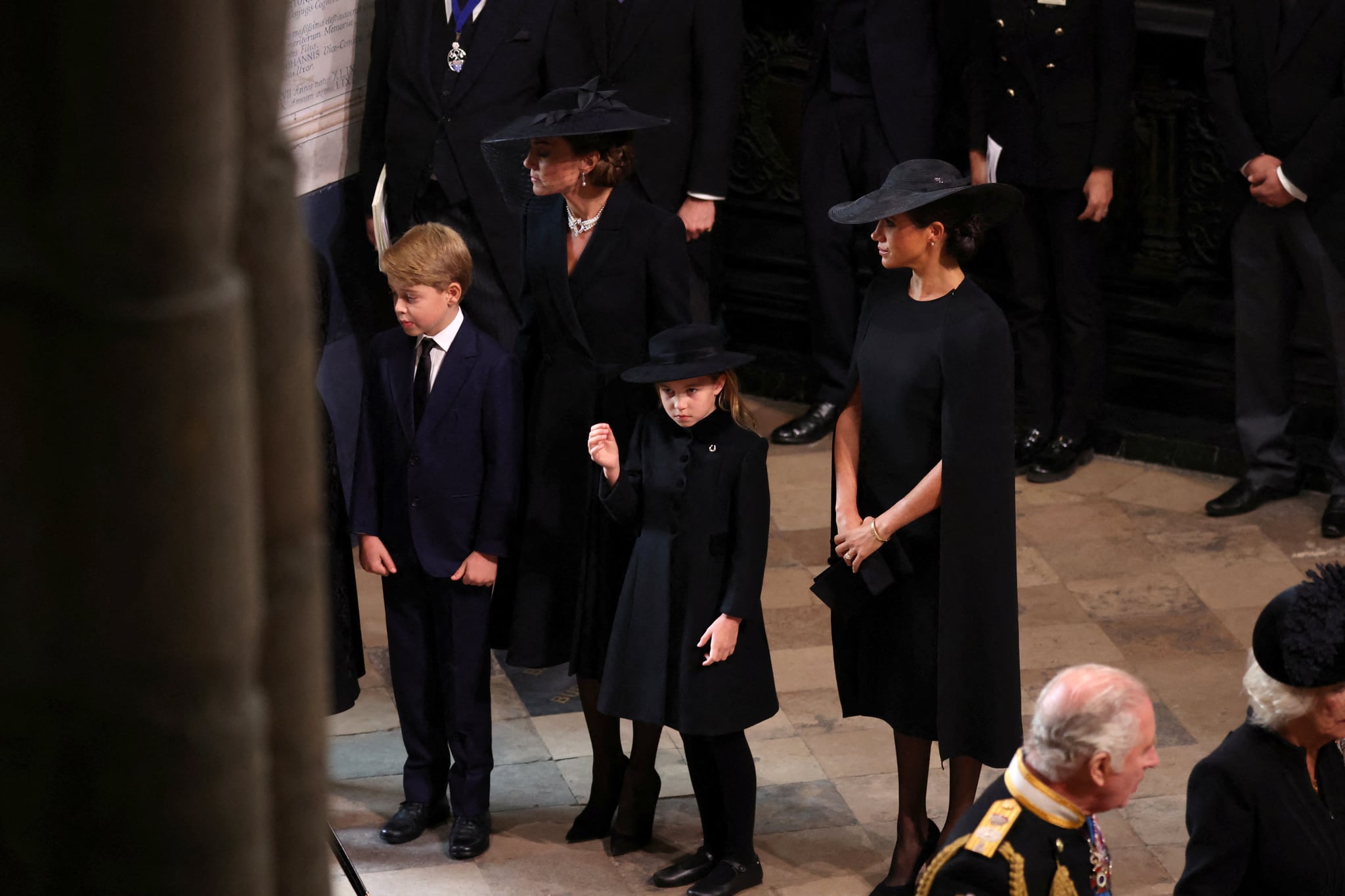 LONDON, ENGLAND - SEPTEMBER 19: King Charles III.  and Camilla, Queen Consort, Catherine, Princess of Wales, Meghan, Duchess of Sussex, Prince George and Princess Charlotte arrive for the State Funeral of Queen Elizabeth II to be held at Westminster Abbey on September 19, 2022 in London, England.  Elizabeth Alexandra Mary Windsor was born on April 21, 1926 in Bruton Street, Mayfair, London.  She married Prince Philip in 1947 and acceded to the throne of the United Kingdom and Commonwealth on 6 February 1952 after the death of her father, King George VI.  Queen Elizabeth II died at Balmoral Castle in Scotland on 8 September 2022 and is succeeded by her eldest son, King Charles III.  (Photo by Phil Noble - WPA Pool/Getty Images)