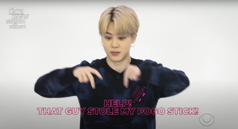 Jimin From BTS Doing a "Help! That Guy Stole My Pogo Stick!" Hand Gesture
