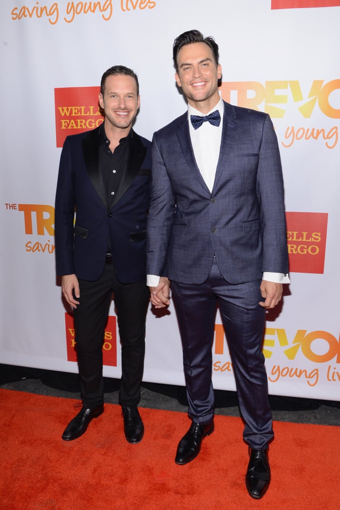 Cheyenne Jackson and his fiancé, Jason Landau, held hands.