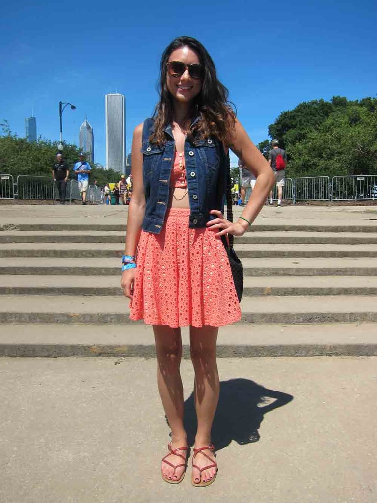 Don't let the light coral hue or the prep-friendly eyelets deceive you: this skirt is secretly a bare midriff in good-girl's clothing. Still, Jackie kept her Urban Outfitters skirt-and-bandeau-top set demure by layering a dark-wash Levi's vest on top.