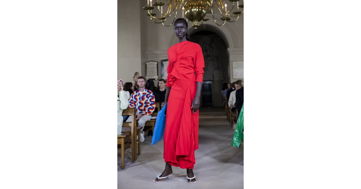 A Red Dress and Blue Bag from the A.W.A.K.E. Mode Runway at London