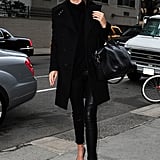 Miranda went all black in cropped leather pants, pointy pumps, a turtleneck sweater, black coat, her trusty Givenchy bag, and round Stella McCartney sunglasses in NYC.