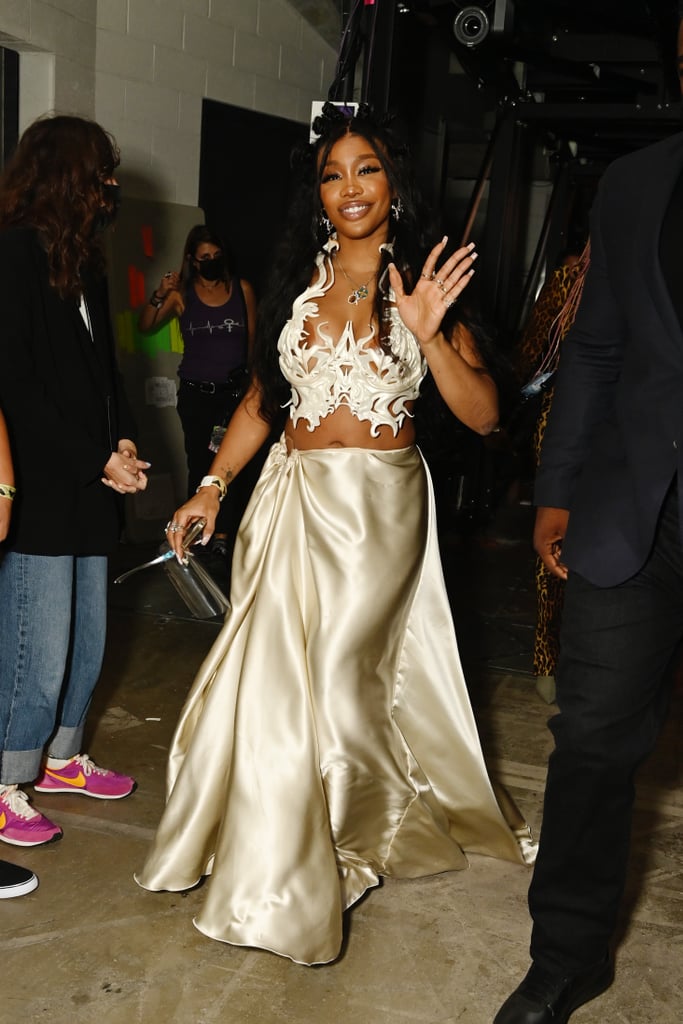 SZA wasn't letting a little 2021 MTV VMAs mishap stop her from enjoying the night. On Sunday, the singer cheekily shared on Instagram Stories that she was a little too fashionably late to hit the red carpet. It's our loss actually, because we missed out on some presumably stunning photos. But it all worked out in the end when SZA smiled on stage to accept the award for best collaboration for her song "Kiss Me More" with Doja Cat. Doja Cat accepted the award in a head-turning "worm"-like Thom Browne dress, and SZA's 3-D printed Nusi Quero top was as cool as can be. She posed for selfies with Lil Nas X, hung out with Ashanti, and looked gorgeous per usual. Check out photos from SZA's award-winning VMAs night ahead.

    Related:

            
            
                                    
                            

            Have Mercy! Nothing Could Have Prepared Us For Chloe Bailey&apos;s Solo Debut at the VMAs