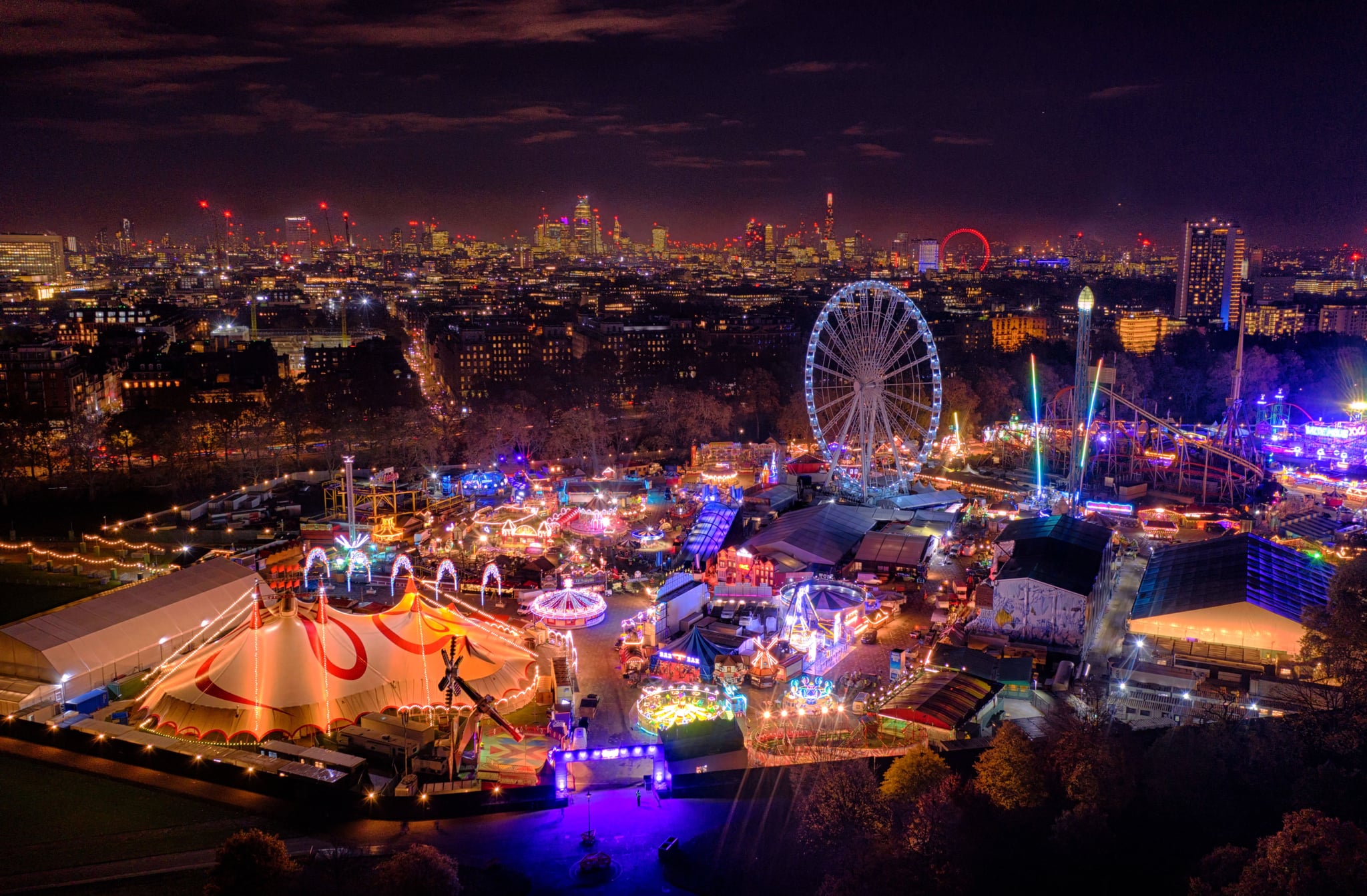 LONDON, UNITED KINGDOM - NOVEMBER 20: Winter Wonderland fair marks the start of the Christmas season in Central London at Hyde Park on November 20, 2019 in London United Kingdom. The Shard and The London Eye can be seen in the background. (Photo by Chris Gorman/Getty Images)