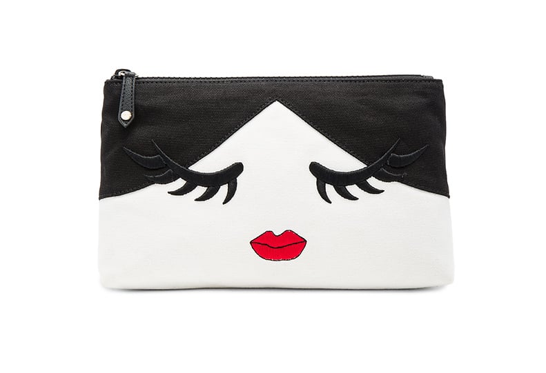Why you need it: Use this kitschy canvas bag as a clutch. 
Alice + Olivia Stace Face Wink Cosmetics Bag ($98)