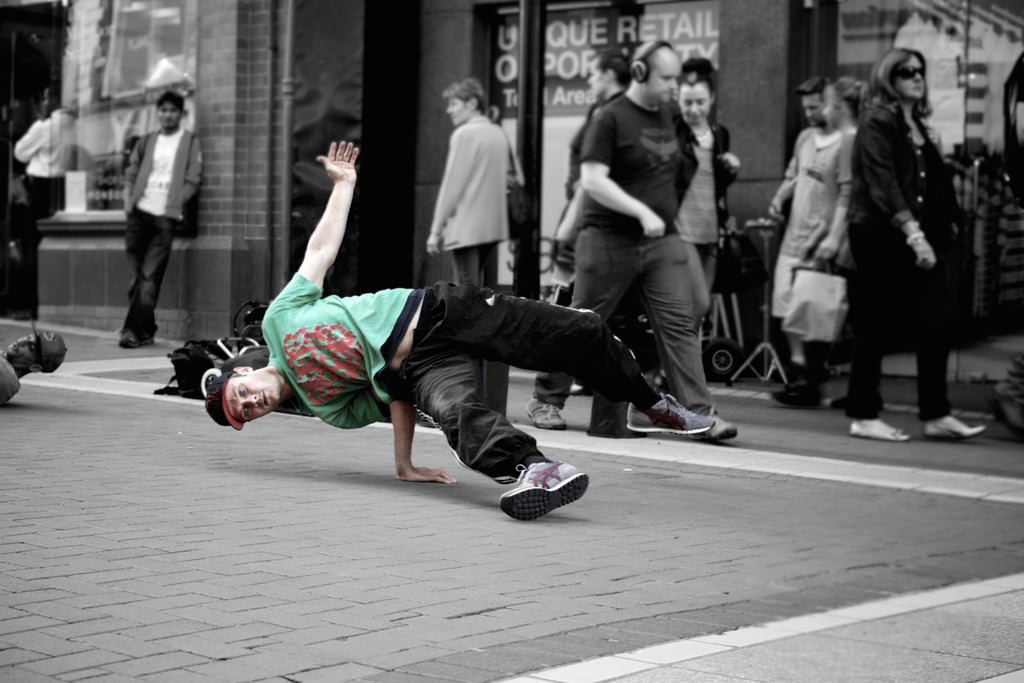 Tip a street performer.
