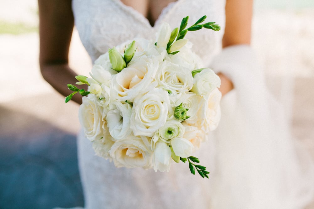 Zoom In on the Bouquet With a Soft Sandy Backdrop