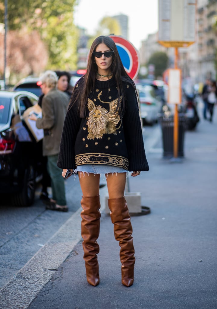 Layer an oversize sweater over a miniskirt and finish with tall boots for drama.