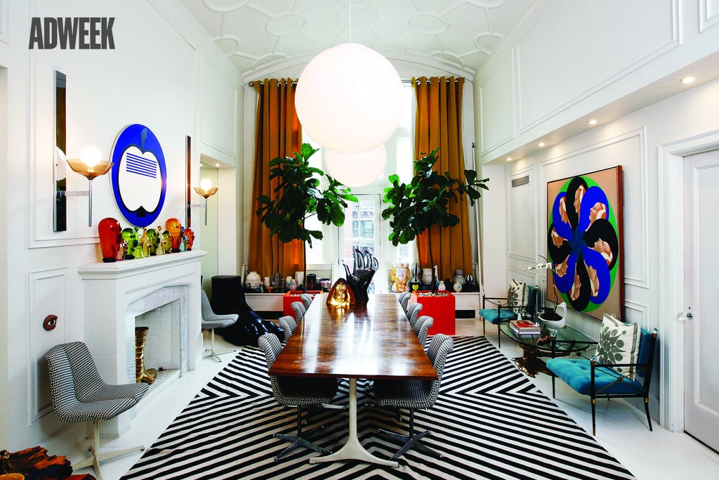Their stunning dining room is outfitted with a statuesque Giant Lucite Hand ($1,295) and a massive Black Bridget Kilim Flat Weave Rug ($400, originally $595).