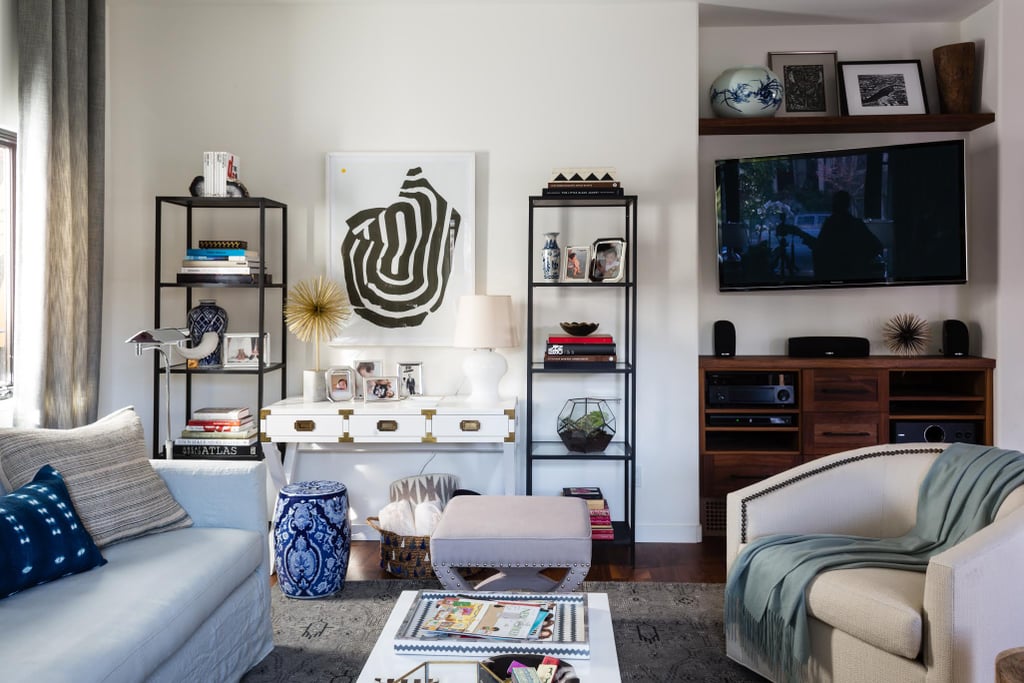Avoid making your TV the star: Erica mounted the flat screen on the wall and placed a cabinet below and a floating shelf above to distract the eye.