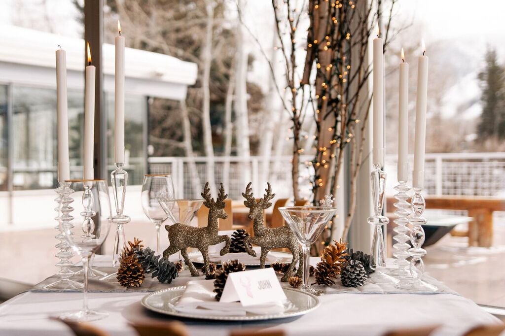 Sparkly deer and twinkle lights make this Winter wedding table unique.