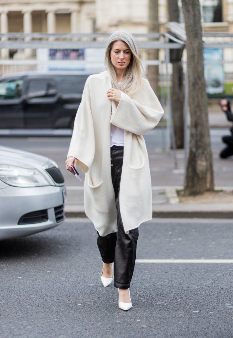 A Long Cream-Colored Cardigan, Leather Trousers, and Heels