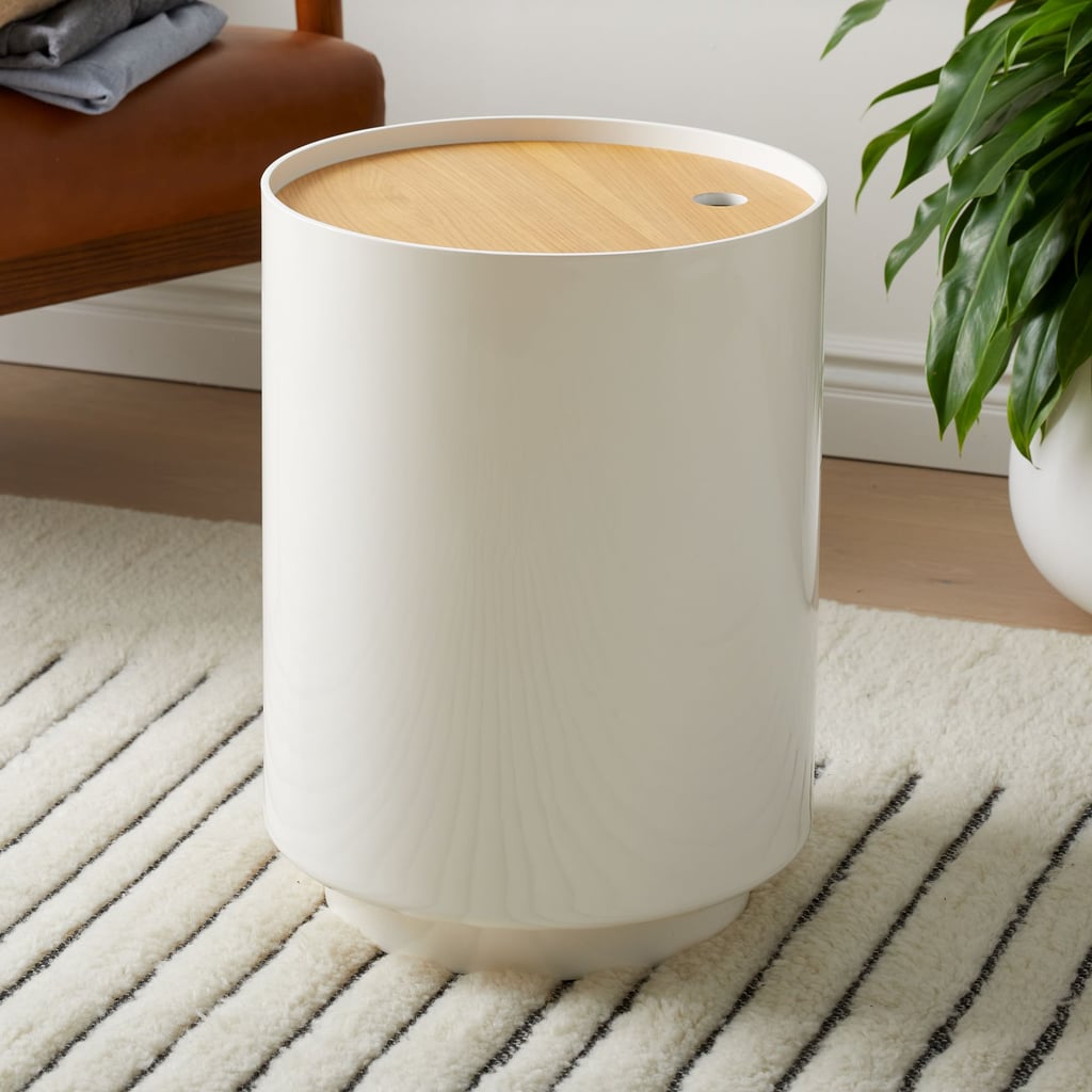 West Elm Jasper Wood Lidded Baskets ($160)
Looking for something durable and sturdy? You can't go wrong with this stylish and sleek piece from West Elm. It comes with a lid that keeps your throw blankets protected from dust and also out of sight. This storage basket can also serve as a side table. You can get this in a light wood shade or a darker wood shade.