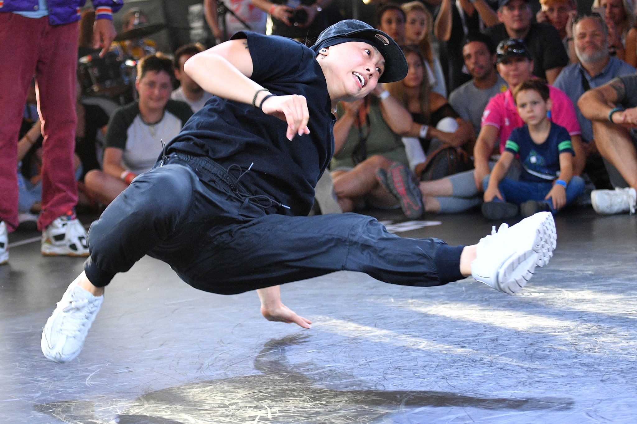 Sunny (Grace Choi) from the US performs on the stage of the break dance final at the World Urban Games in Budapest, Hungary on September 14, 2019. - The World Urban Games (WUG) is a three-day multi-sport event featuring competition and showcase sports of the best street-athletes of the World, alongside a cultural festival here. (Photo by ATTILA KISBENEDEK / AFP)        (Photo credit should read ATTILA KISBENEDEK/AFP via Getty Images)