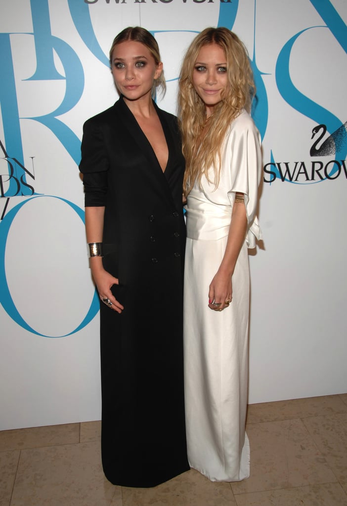 Twinning combo: The girls donned contrasting column gowns for the 25th CFDA Fashion Awards in June 2007.

Ashley borrowed her sister's edgy effervescence in a black tuxedo gown and slick updo. 
Mary-Kate took a page from her sister's pristine playbook, working a darling white kimono-style wrap gown.