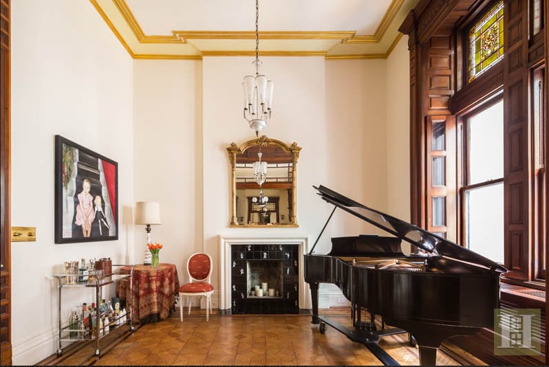 Previously owned by West Side Story maestro Leonard Bernstein, the Midtown luxury residence boasts nine rooms, five fireplaces, and architectural details straight out of a museum, like 14-foot ceilings and hand-carved mahogany doors. The listing was held by Halstead Property.