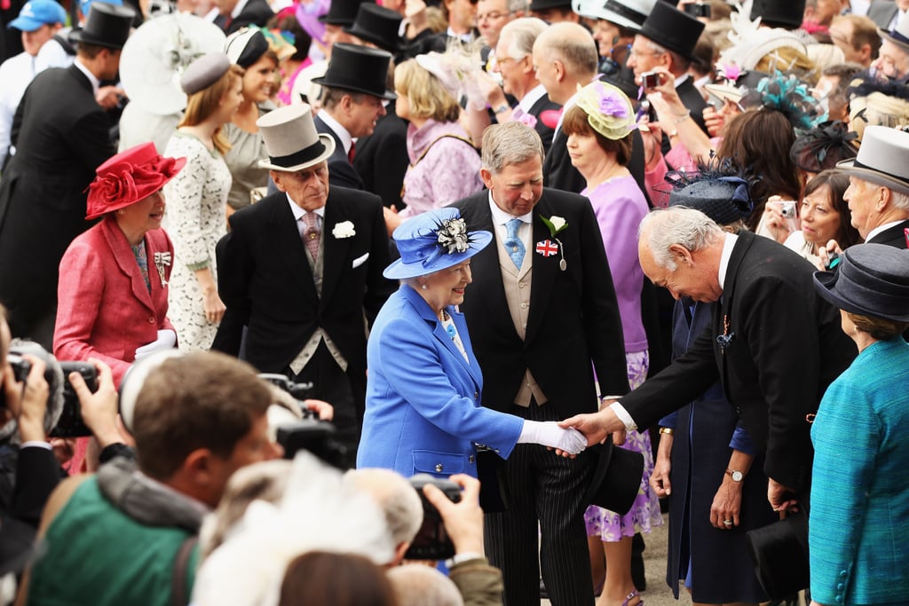 The queen greeted a racegoer.
The queen greeted a racegoer.