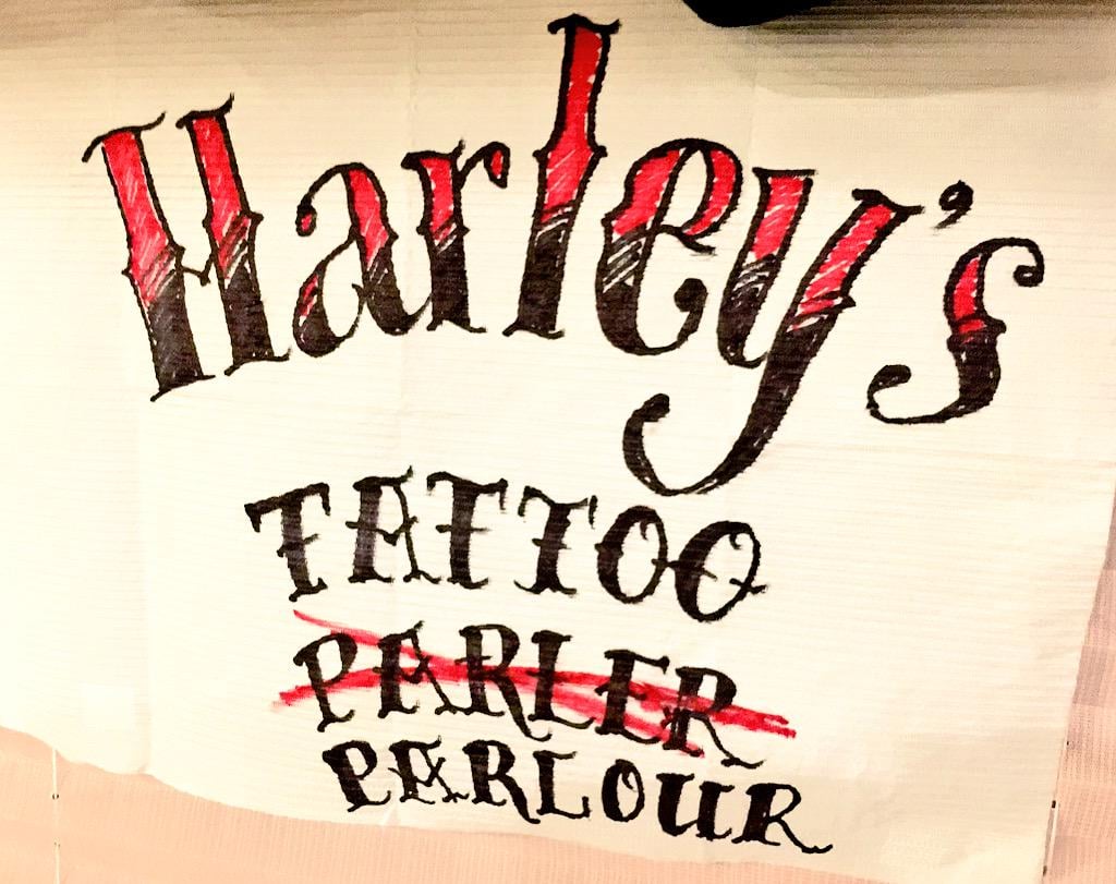 We also got to see a makeshift sign for Harley Quinn's misspelled tattoo parlour.