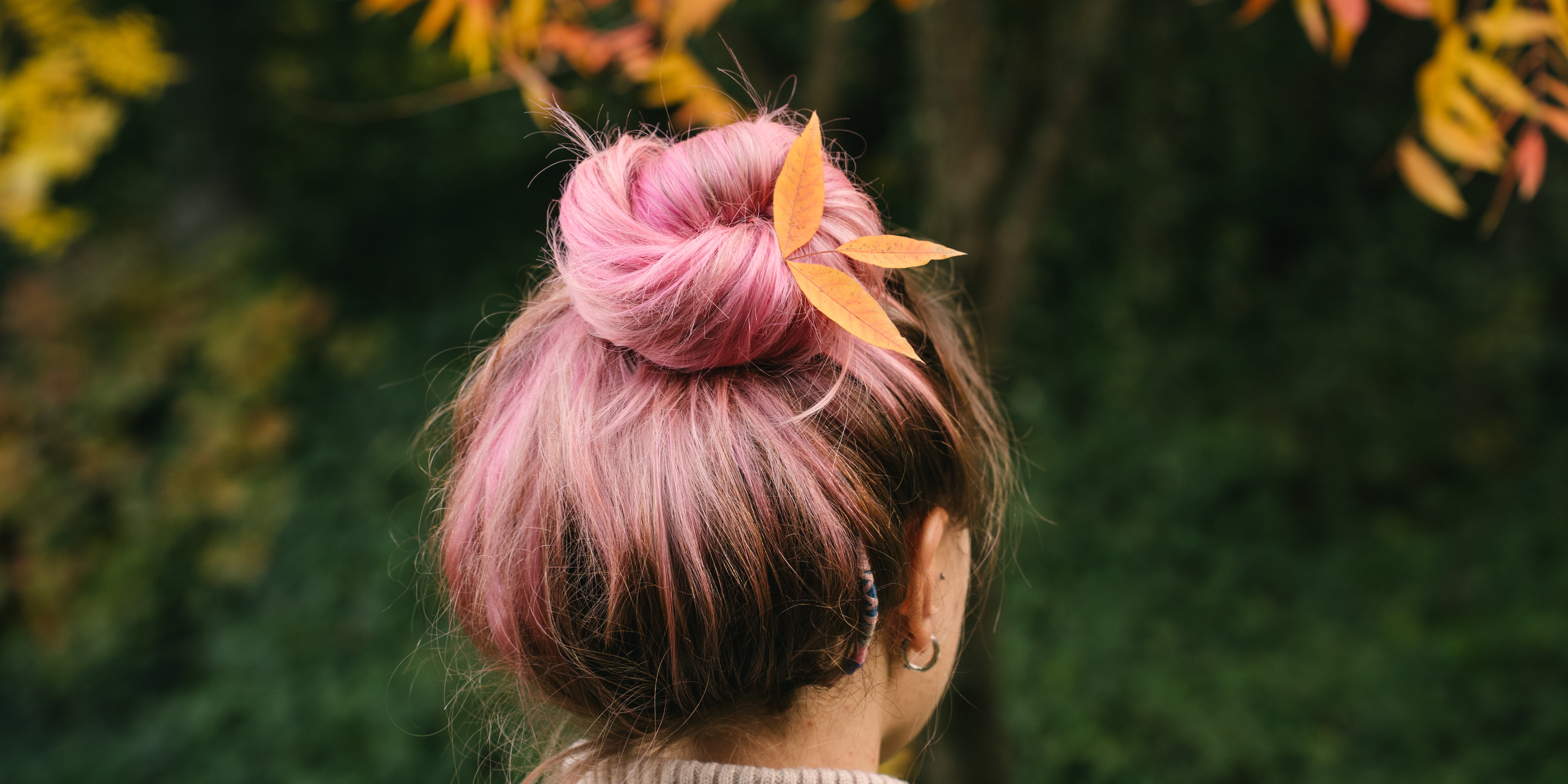 Woman with hair on pillow indicating autumn hair shedding