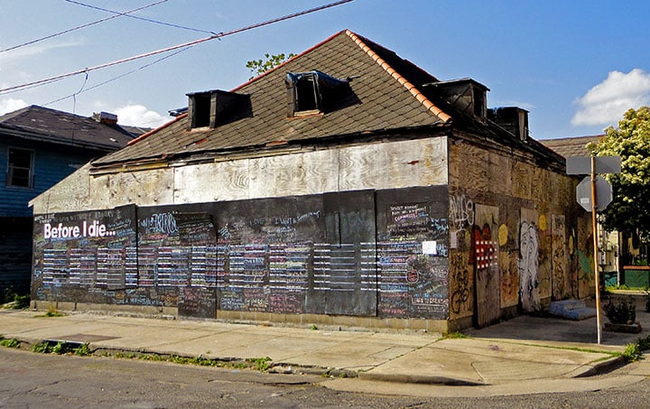 The original New Orleans "Before I Die" was posted on the side of an abandoned house. 
Photo courtesy of CandyChang.com