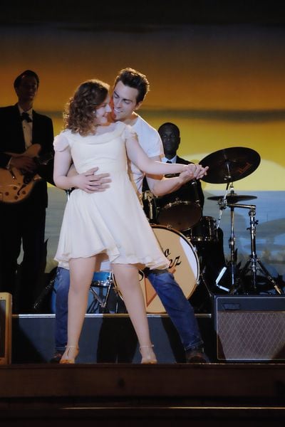 Here she is in a dangerously short dress.