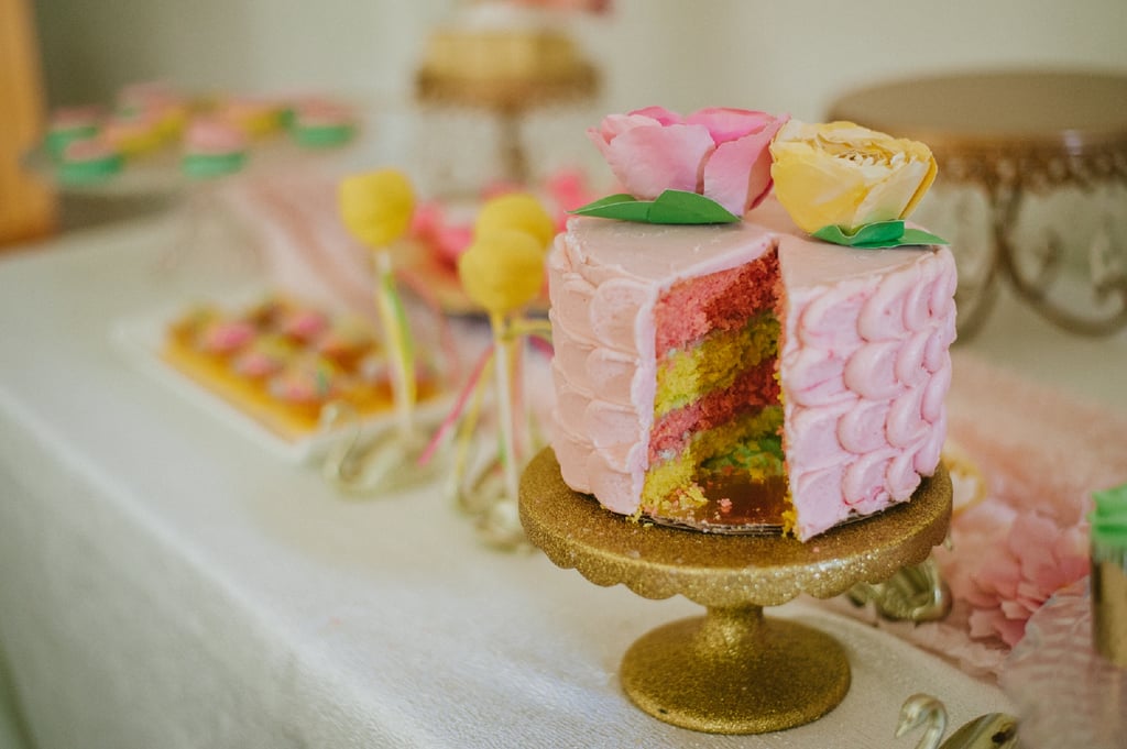 The pink and lemon-yellow cake revealed that the guest of honor is having a girl.