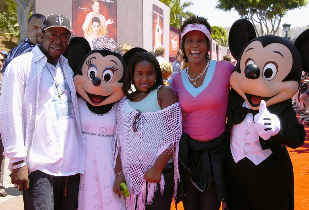 Bobby, Bobbi Kristina, and Whitney posed with Mickey and Minnie Mouse at the red carpet premiere of The Princess Diaries 2 in August 2004.
