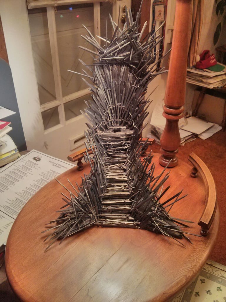 This Iron Throne Phone Charging Stand Made of 1,000 Miniswords