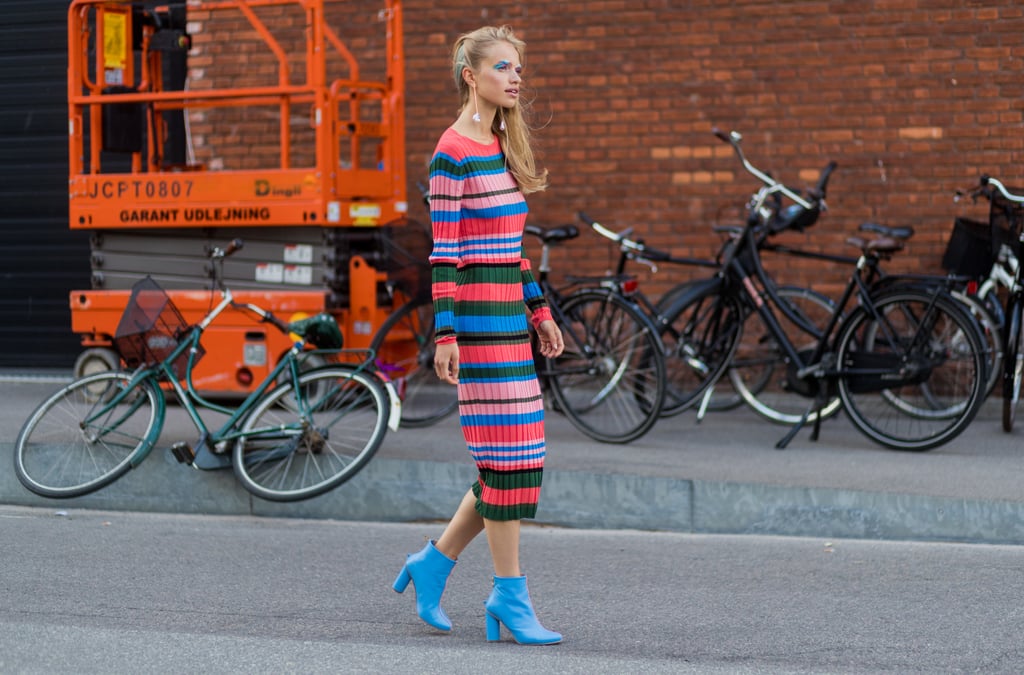 We love wearing body-con dresses with heeled ankle boots, as it makes us look a little taller too. This model took a fashion-girl tip and matched her blue boots to one part of her dress.