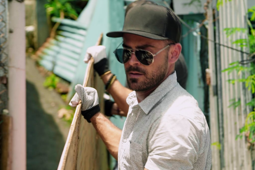 Efron, looking as fashionable as ever, gets down and dirty by helping a family whose house was destroyed by Hurricane Maria in Puerto Rico.