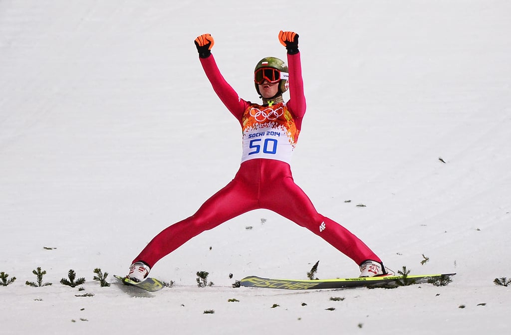 Polish ski jumper Kamil Stoch put his hands up after winning the gold medal in the men's normal hill individual final.