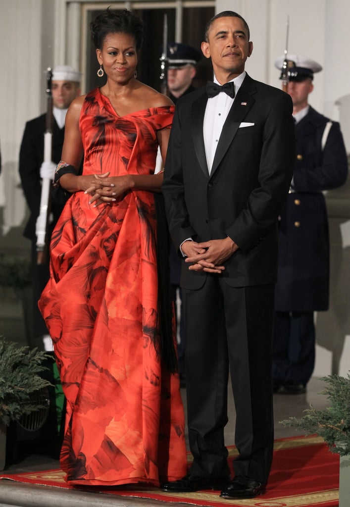 Michelle stunned in this red-and-black gown by Sarah Burton for Alexander McQueen.
Michelle stunned in this red-and-black gown by Sarah Burton for Alexander McQueen.